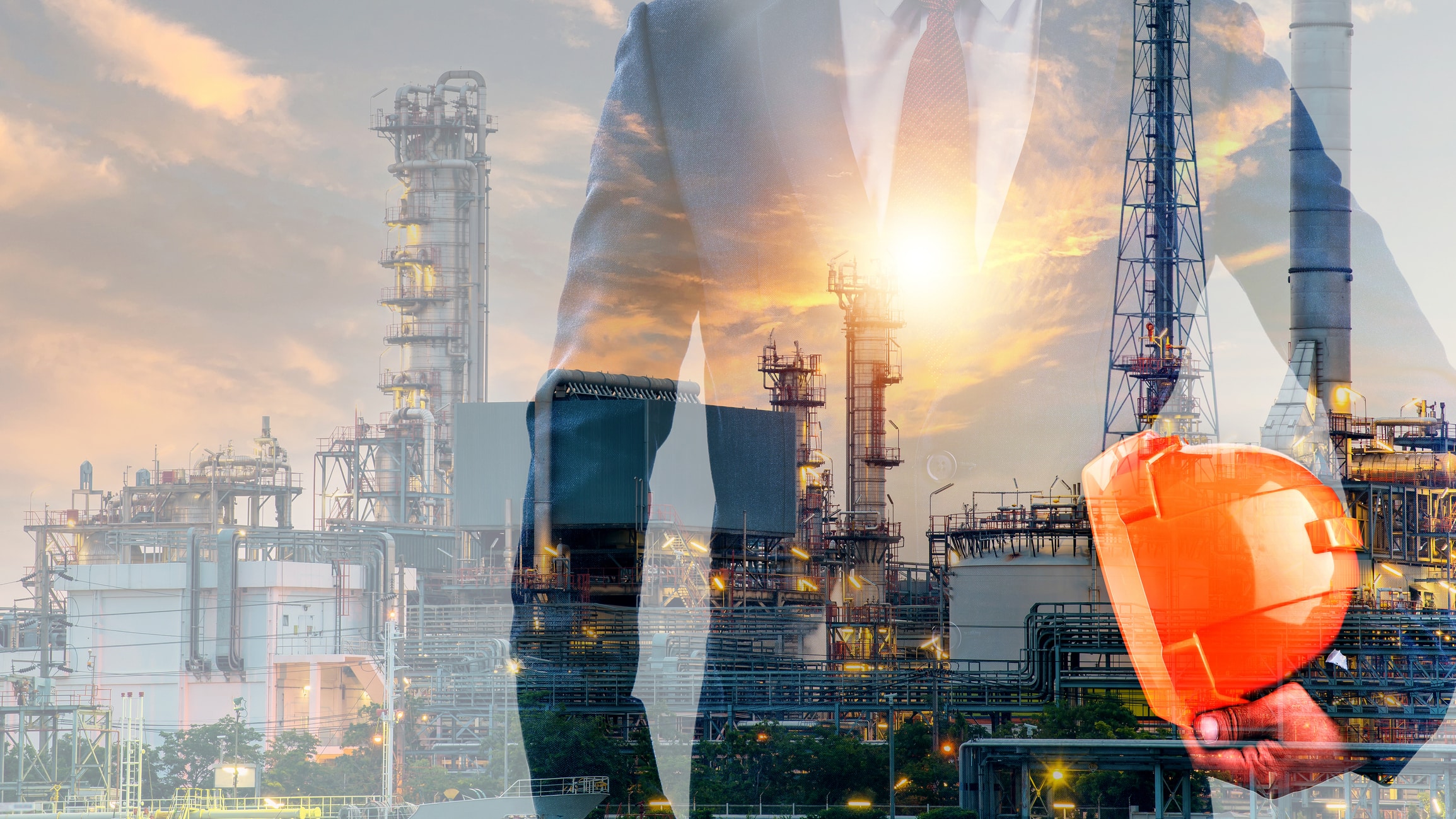 Double exposure of businessman or engineer hole orange helmet in hand with oil and gas refinery plant background