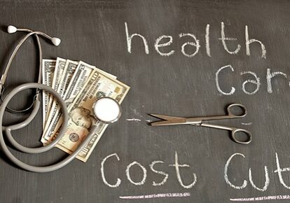 Health cost cut up concept written on blackboard